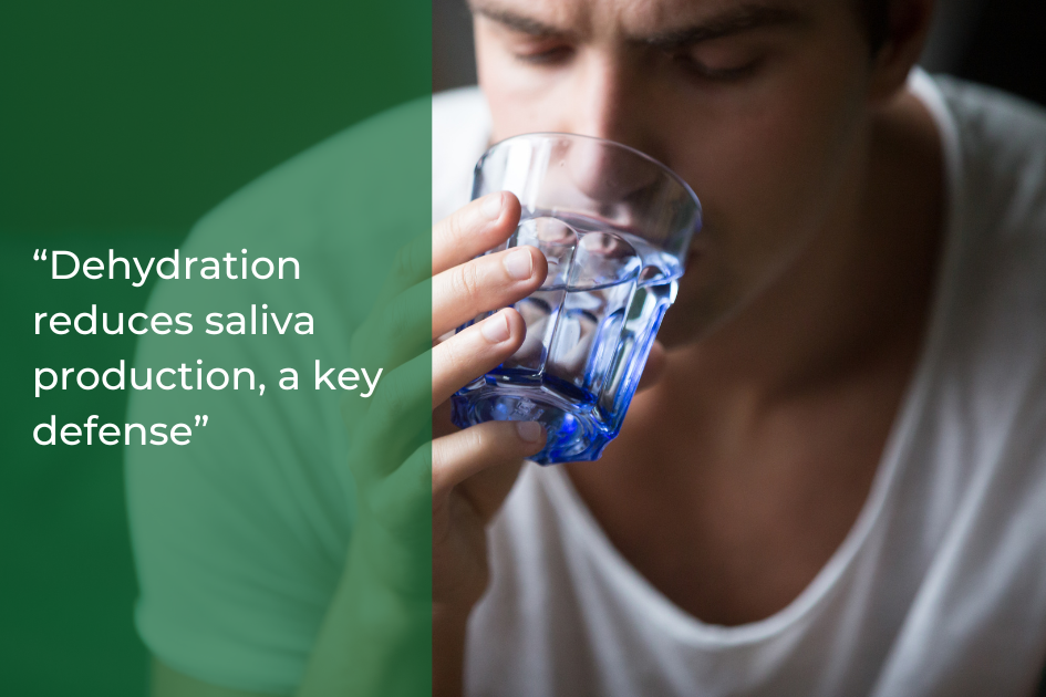 Person drinking from a blue glass, with text on left: &quot;Everyday habits like staying hydrated are vital, as dehydration reduces saliva production—a key defense. Maintain oral health and keep your smile bright.